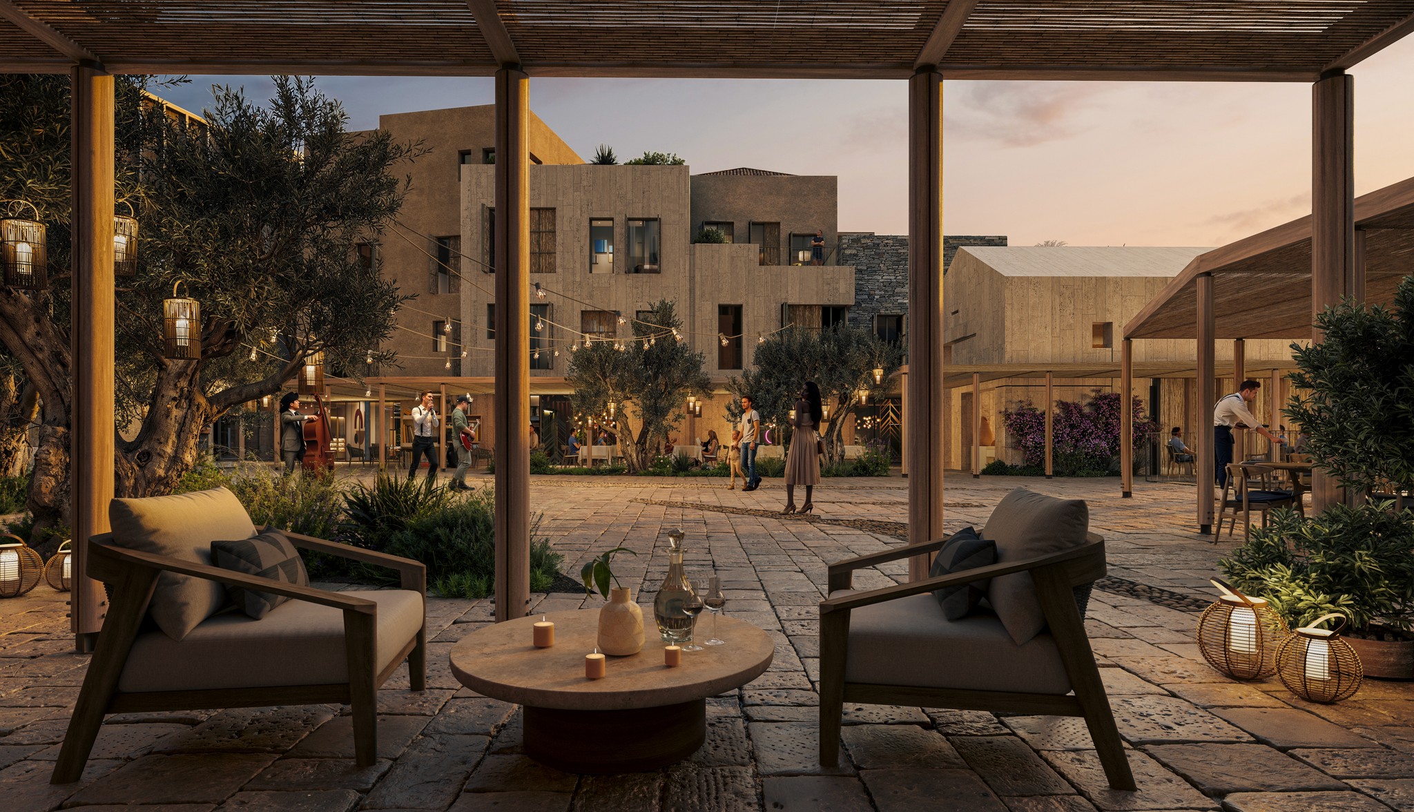Modern stone exterior of Green Village Hotel with a tall tower and landscaped grasses.